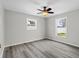This bedroom offers two windows, ceiling fan, and neutral paint palette at 6358 Dakota Dr, Brooksville, FL 34602