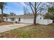 A well-kept home features an attached garage, a cozy yard, and a private fence at 6358 Dakota Dr, Brooksville, FL 34602
