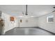 Well-lit garage space with water heater and added storage area, perfect for projects and organization at 6358 Dakota Dr, Brooksville, FL 34602