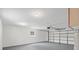 Spacious garage with large roll up door provides secure parking and ample storage space at 6358 Dakota Dr, Brooksville, FL 34602
