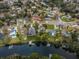 Overhead view of homes along canal featuring private docks and boats, showcasing waterfront living in a residential neighborhood at 646 Riverside Dr, Tarpon Springs, FL 34689