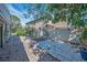 Charming backyard featuring a paved area, privacy fence, and potential for outdoor enjoyment and relaxation at 646 Riverside Dr, Tarpon Springs, FL 34689