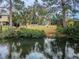 Spacious fenced backyard with canal views, perfect for outdoor activities and enjoying waterfront living at 646 Riverside Dr, Tarpon Springs, FL 34689