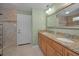Bathroom featuring double sinks, granite countertops, vanity, and tiled flooring at 646 Riverside Dr, Tarpon Springs, FL 34689