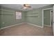 Bedroom with a window, tiled flooring, ceiling fan, and shelving at 646 Riverside Dr, Tarpon Springs, FL 34689