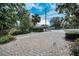Beautiful paver driveway, mature trees, and manicured landscaping create a welcoming entrance at 646 Riverside Dr, Tarpon Springs, FL 34689