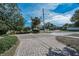 Paver driveway provides ample parking and enhances the curb appeal of this charming home at 646 Riverside Dr, Tarpon Springs, FL 34689
