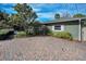 Charming home exterior with a brick driveway and mature landscaping, perfect for curb appeal at 646 Riverside Dr, Tarpon Springs, FL 34689