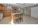 Large kitchen featuring granite countertops, stainless steel appliances, and a center island with seating at 646 Riverside Dr, Tarpon Springs, FL 34689