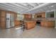 Updated kitchen features stainless steel appliances and a breakfast bar at 646 Riverside Dr, Tarpon Springs, FL 34689