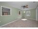 Bright living room with tile flooring, ceiling fan, and lots of natural light at 646 Riverside Dr, Tarpon Springs, FL 34689