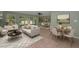 Airy living room boasts a modern design, neutral tones, and a seamless flow into the dining area at 646 Riverside Dr, Tarpon Springs, FL 34689