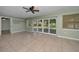 Living room with access to the lanai with sliding glass doors at 646 Riverside Dr, Tarpon Springs, FL 34689
