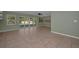 Open living room featuring large sliding glass doors to the lanai at 646 Riverside Dr, Tarpon Springs, FL 34689