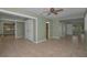 Large open living room with easy access to the bathroom, bedroom, and backyard at 646 Riverside Dr, Tarpon Springs, FL 34689