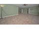 Living room with ample space, neutral paint, and convenient shelving at 646 Riverside Dr, Tarpon Springs, FL 34689