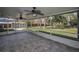 Inviting screened porch with decorative tile flooring, providing a comfortable outdoor living space at 646 Riverside Dr, Tarpon Springs, FL 34689