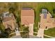 Aerial view of the property showing the backyard, roof and relationship to adjacent homes at 6741 Northlake Dr, Zephyrhills, FL 33542