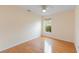 Bedroom featuring natural light from the window and hardwood floors at 6741 Northlake Dr, Zephyrhills, FL 33542