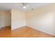 Bedroom with hardwood floors, a ceiling fan, and a large closet at 6741 Northlake Dr, Zephyrhills, FL 33542