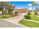 Charming one story home with a brick paver driveway and a well manicured lawn with shade trees at 6741 Northlake Dr, Zephyrhills, FL 33542