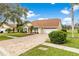Charming one story home with a brick paver driveway and a well manicured lawn and mature landscaping at 6741 Northlake Dr, Zephyrhills, FL 33542