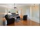 Living room featuring hardwood floors, vaulted ceilings, ceiling fan, and updated furnishings at 6741 Northlake Dr, Zephyrhills, FL 33542