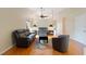 Living room featuring hardwood floors, vaulted ceilings, ceiling fan, and updated furnishings at 6741 Northlake Dr, Zephyrhills, FL 33542