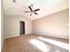 Bright primary bedroom with vaulted ceiling, ceiling fan and cozy carpet floors at 7104 Hummingbird Ln, New Port Richey, FL 34655