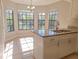Cozy breakfast nook with granite counters and views of the natural surroundings at 7104 Hummingbird Ln, New Port Richey, FL 34655