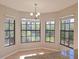 Bright breakfast nook with granite counters and a beautiful view of nature at 7104 Hummingbird Ln, New Port Richey, FL 34655