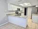 Beautiful kitchen featuring granite countertops, ample cabinets, and stainless steel appliances at 7104 Hummingbird Ln, New Port Richey, FL 34655
