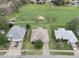 Aerial view of home situated near a golf course with mature trees at 7292 Sherman Hills Blvd, Brooksville, FL 34602