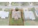 Aerial view of the home highlighting its roof, yard, and proximity to neighboring houses at 7292 Sherman Hills Blvd, Brooksville, FL 34602