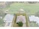 Aerial view of home with a well-maintained lawn and golf course views at 7292 Sherman Hills Blvd, Brooksville, FL 34602