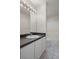 Bathroom with a large mirror, white cabinets, and a shower-tub combo at 7292 Sherman Hills Blvd, Brooksville, FL 34602
