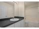 Clean bathroom with a single sink vanity, a large mirror, and a shower and tub combo at 7292 Sherman Hills Blvd, Brooksville, FL 34602