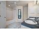 Bathroom with double sinks, tiled floors, and a bathtub-shower combo, offering convenience and comfort at 7292 Sherman Hills Blvd, Brooksville, FL 34602