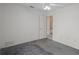 Simple bedroom featuring neutral paint, a ceiling fan, and an open doorway to an adjacent space at 7292 Sherman Hills Blvd, Brooksville, FL 34602