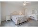 Bright bedroom with ceiling fan, carpet, and ample space for a vanity and nightstand at 7292 Sherman Hills Blvd, Brooksville, FL 34602