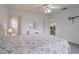 Bright bedroom with ceiling fan, carpet, vanity and access to other rooms at 7292 Sherman Hills Blvd, Brooksville, FL 34602