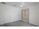 Comfortable bedroom with a ceiling fan and view to the hallway and carpet floor at 7292 Sherman Hills Blvd, Brooksville, FL 34602
