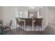 A bright dining area featuring a breakfast bar with seating and carpeted floors at 7292 Sherman Hills Blvd, Brooksville, FL 34602