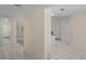 Bright entryway with neutral walls, white tile floors and clear access to the rest of the house at 7292 Sherman Hills Blvd, Brooksville, FL 34602