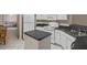 Well-lit kitchen featuring white appliances, dark countertops and a functional layout at 7292 Sherman Hills Blvd, Brooksville, FL 34602