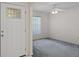 Bright living room with an open doorway and large window at 7292 Sherman Hills Blvd, Brooksville, FL 34602
