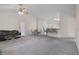 Spacious living room features a high ceiling and ceiling fan plus an eating area with barstool seating at 7292 Sherman Hills Blvd, Brooksville, FL 34602