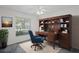 Cozy office featuring built-in shelving and a comfortable workspace with natural light at 7292 Sherman Hills Blvd, Brooksville, FL 34602