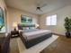 Inviting primary bedroom with a large bed, stylish decor, and a peaceful ambiance at 7523 Greystone Dr # 35, Hudson, FL 34667