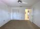 A standard bedroom featuring a ceiling fan and a closet at 7523 Greystone Dr # 35, Hudson, FL 34667
